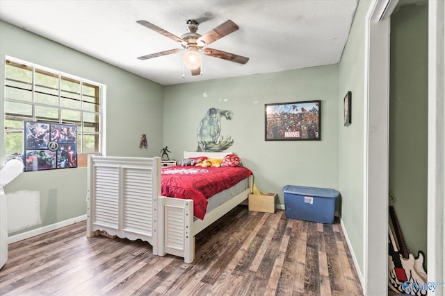 bedroom featuring ceiling fan and hardwood / wood-style flooring