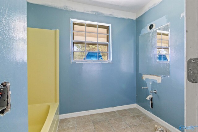 bathroom with tile patterned floors