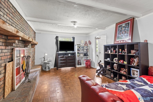 living room with a fireplace, a textured ceiling, parquet flooring, and beam ceiling