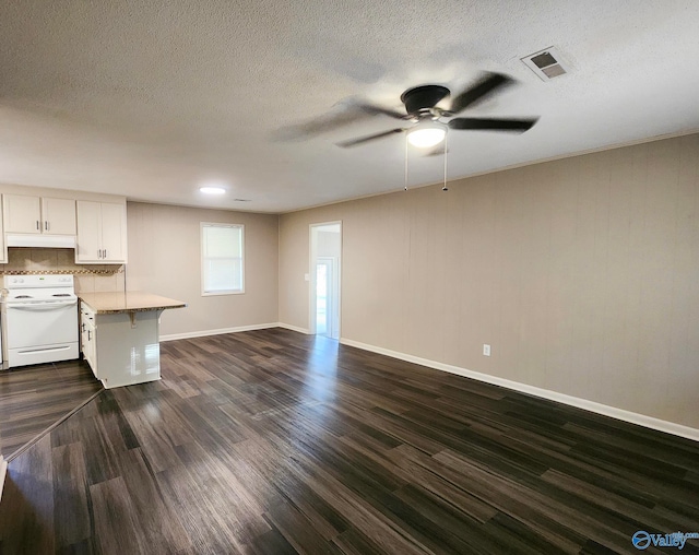 unfurnished living room featuring visible vents, a textured ceiling, baseboards, ceiling fan, and dark wood-style flooring