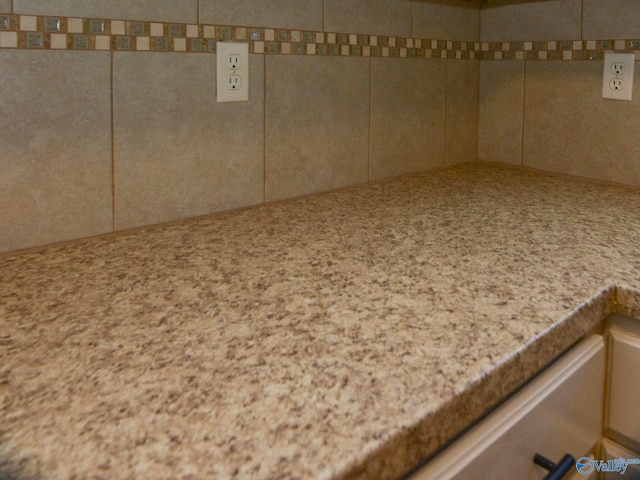 room details featuring light stone countertops