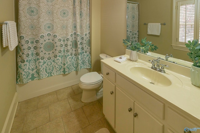 full bathroom with shower / bath combo with shower curtain, vanity, tile patterned floors, and toilet