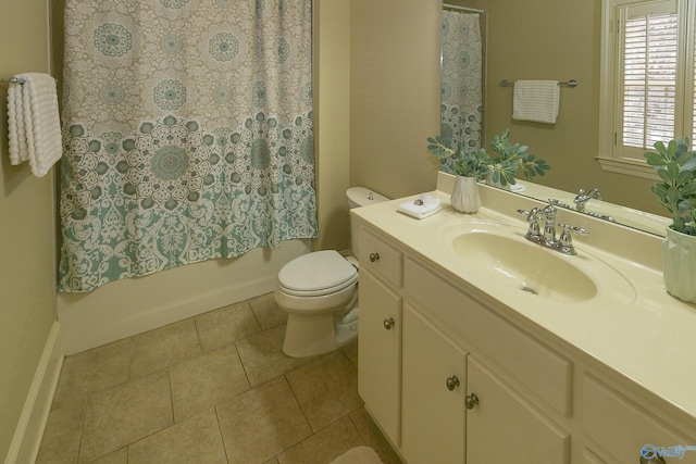 bathroom featuring toilet, tile patterned flooring, shower / tub combo with curtain, and vanity