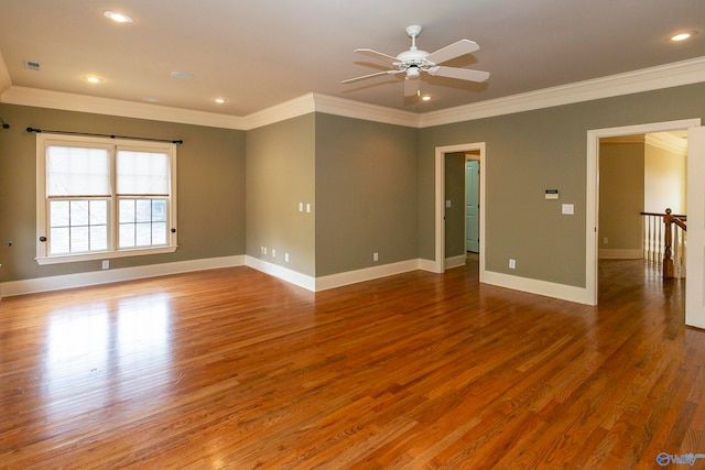 spare room with crown molding, hardwood / wood-style floors, and ceiling fan