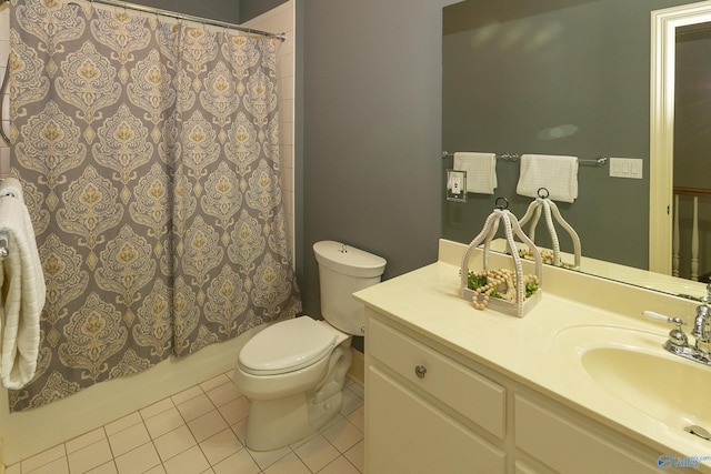 bathroom featuring vanity, tile patterned flooring, and toilet