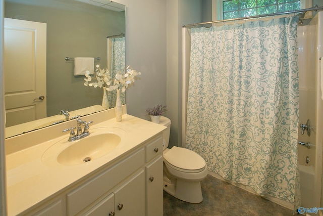 full bathroom with vanity, shower / bath combo, and toilet