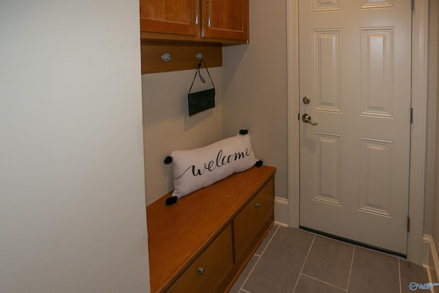 mudroom featuring dark tile patterned floors