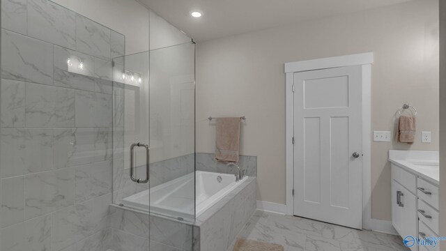 full bath with a shower stall, marble finish floor, a bath, vanity, and baseboards