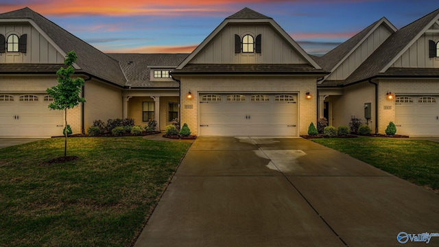 craftsman-style home featuring brick siding and board and batten siding