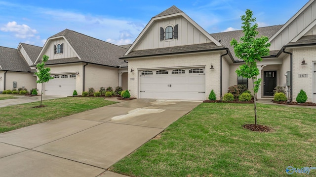 view of front of property featuring brick siding, board and batten siding, a front yard, and concrete driveway