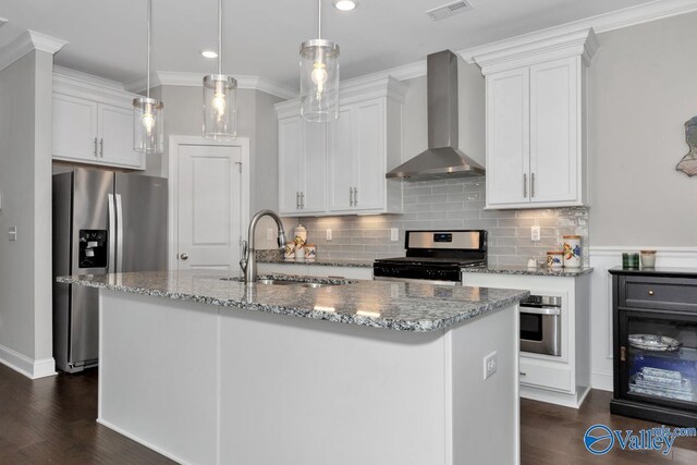 kitchen with white cabinets, sink, wall chimney exhaust hood, and appliances with stainless steel finishes