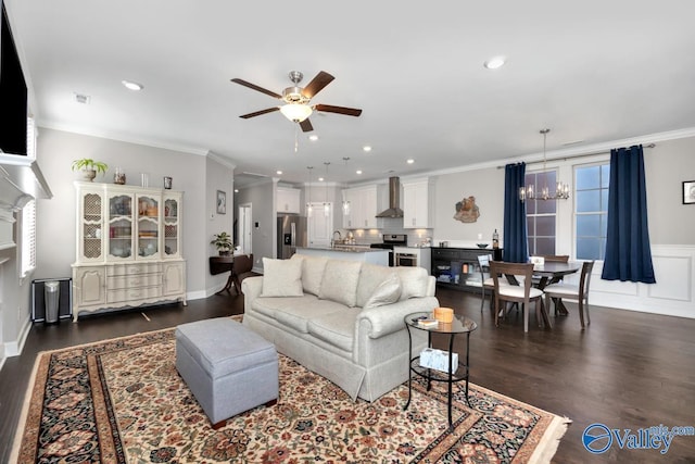 living room featuring a fireplace, crown molding, dark hardwood / wood-style flooring, and a healthy amount of sunlight