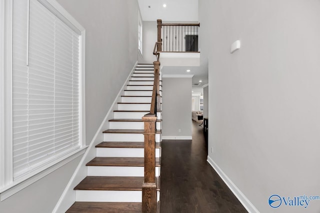 stairway featuring hardwood / wood-style flooring