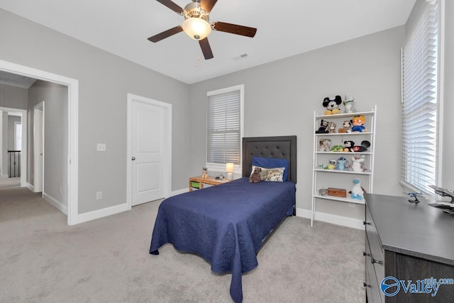 carpeted bedroom featuring ceiling fan