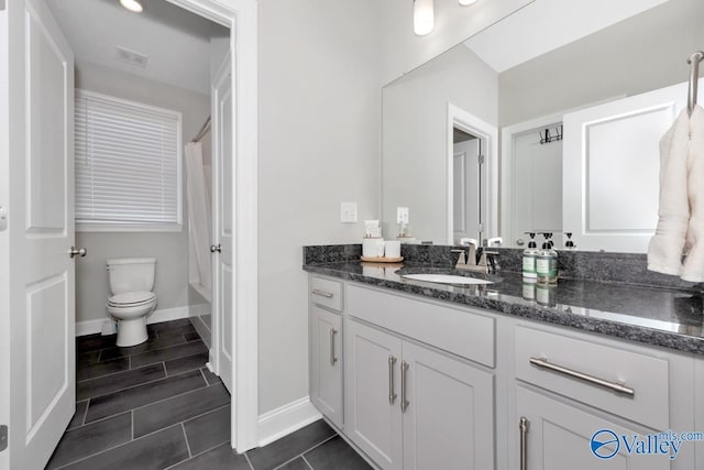 full bathroom featuring shower / tub combo, vanity, and toilet