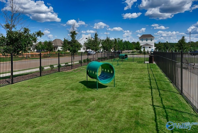 view of home's community with a lawn