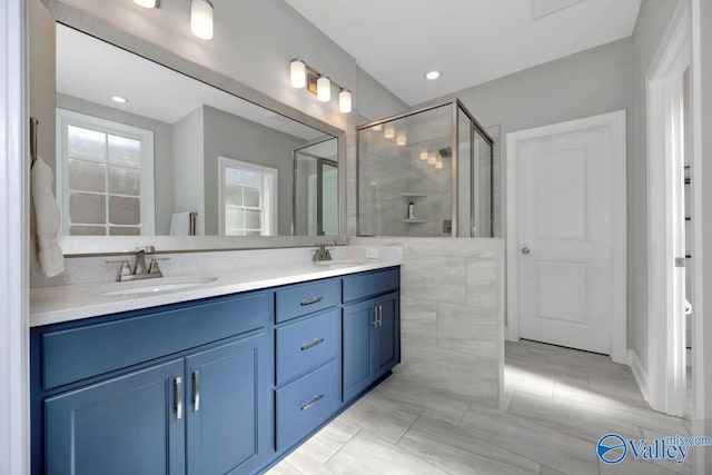 bathroom with vanity and an enclosed shower