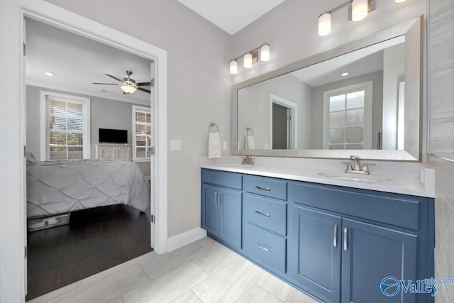 bathroom featuring tile patterned floors, ceiling fan, and vanity