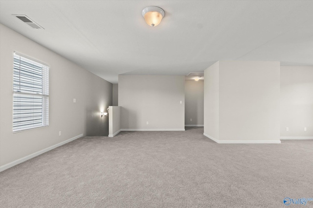 spare room featuring carpet flooring