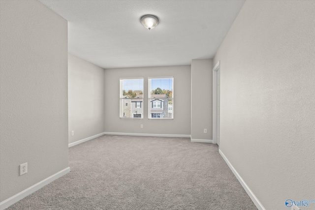 empty room featuring carpet flooring