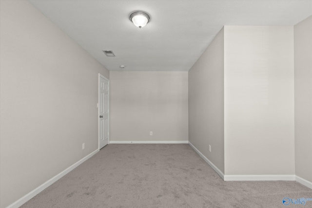 additional living space featuring light colored carpet