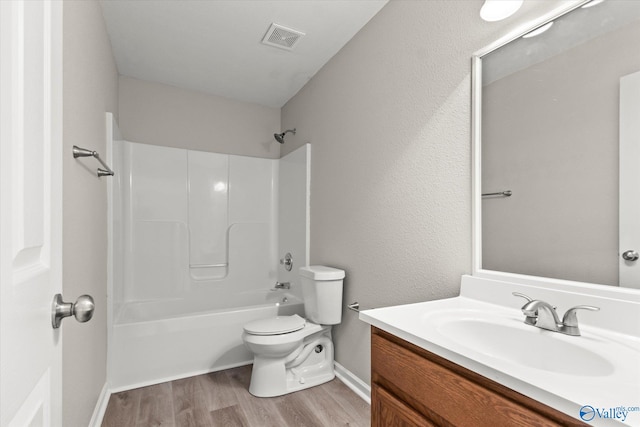 full bathroom with wood-type flooring, vanity, toilet, and shower / bath combination