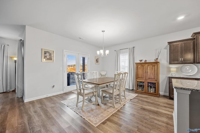 165 Saddle St, New Market, AL 35761 - dining room featuring a chandelier, healthy amount of natural light, and light wood-style flooring