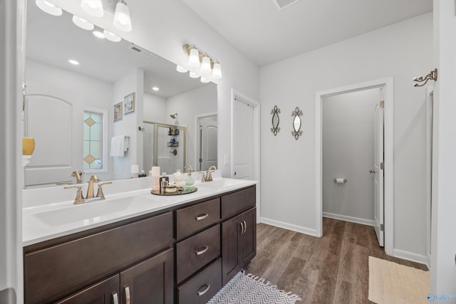 165 Saddle St, New Market, AL 35761 - bathroom featuring wood finished floors, double vanity, and a shower stall