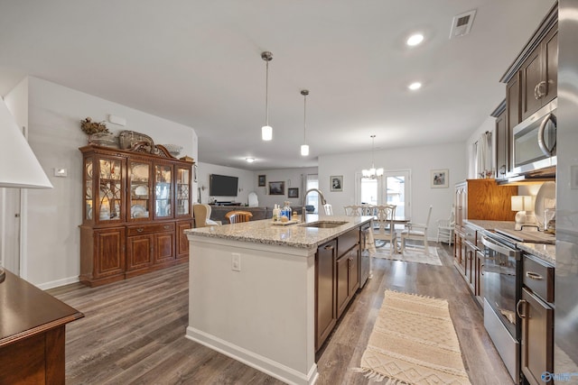 165 Saddle St, New Market, AL 35761 - kitchen with appliances with stainless steel finishes, wood finished floors, a center island with sink, a chandelier, and recessed lighting