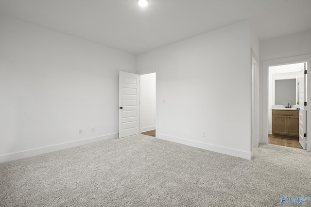 188 Chesire Cove Ln, New Market, AL 35759 - unfurnished bedroom with carpet, baseboards, ensuite bathroom, and a sink