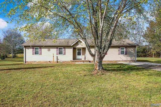 ranch-style home featuring a front yard