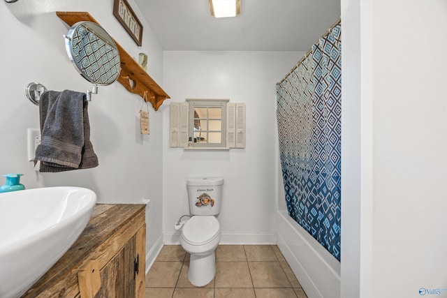 full bathroom featuring tile patterned floors, toilet, shower / tub combo with curtain, and sink