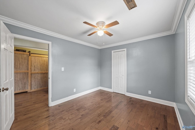 unfurnished bedroom featuring dark hardwood / wood-style flooring, multiple windows, ceiling fan, and crown molding