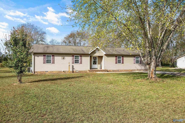 ranch-style house with central AC unit and a front yard