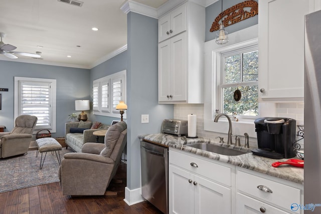 kitchen featuring dishwasher, white cabinetry, dark wood-type flooring, and plenty of natural light