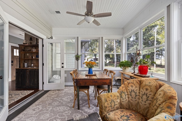 sunroom / solarium featuring wood ceiling and ceiling fan