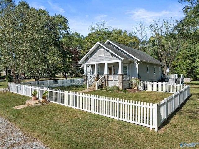 view of front of house with covered porch and a front yard