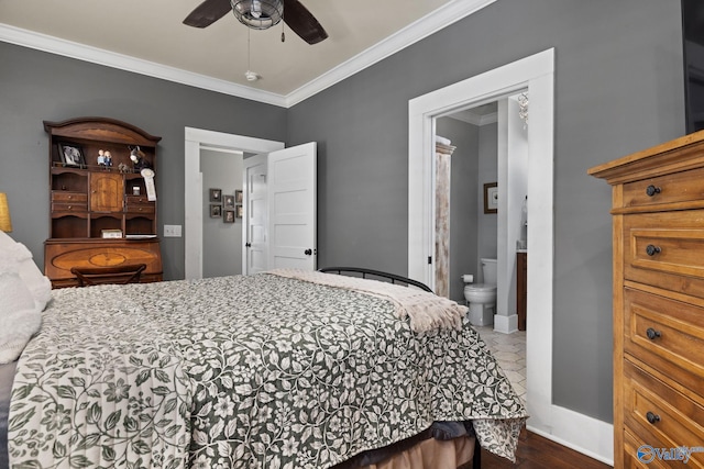 bedroom with ornamental molding, ensuite bathroom, dark hardwood / wood-style floors, and ceiling fan