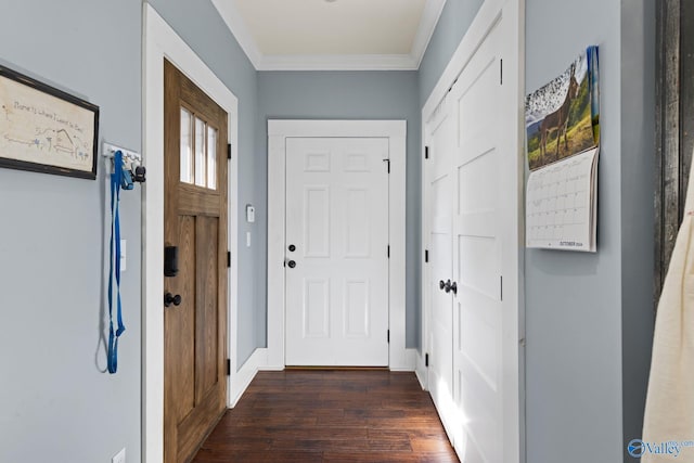 doorway to outside with ornamental molding and dark hardwood / wood-style flooring