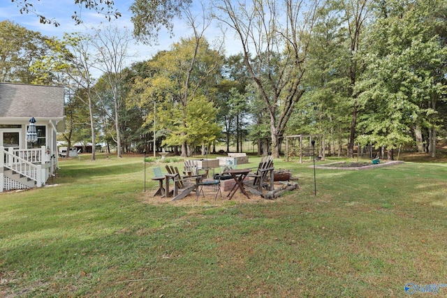 view of yard with a fire pit