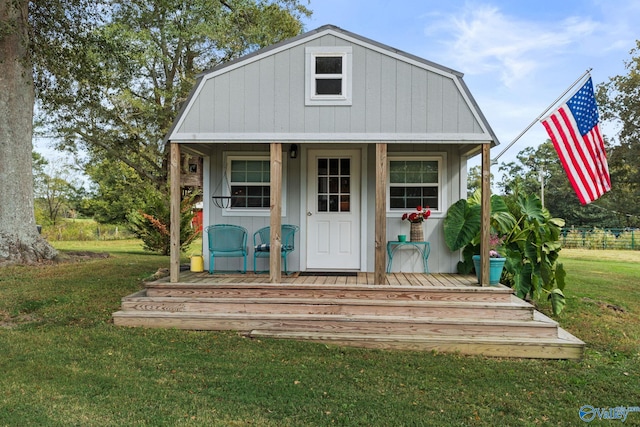 view of outbuilding featuring a lawn