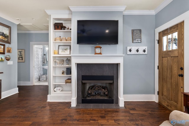 living room with ornamental molding, dark hardwood / wood-style floors, and a fireplace