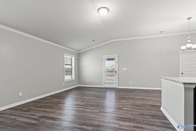 unfurnished living room featuring ornamental molding, lofted ceiling, dark wood-style flooring, and an inviting chandelier