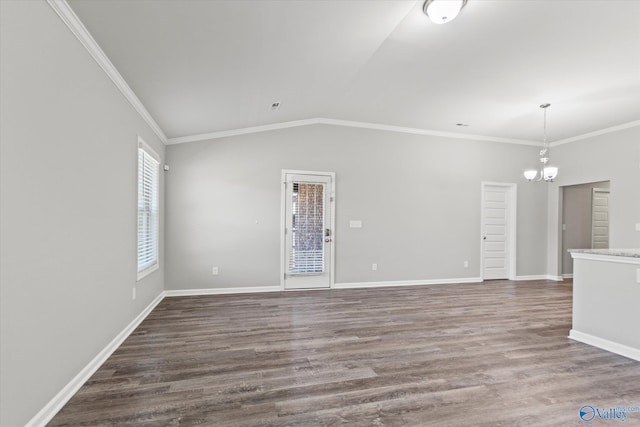 spare room featuring dark wood-style floors, crown molding, lofted ceiling, and a notable chandelier