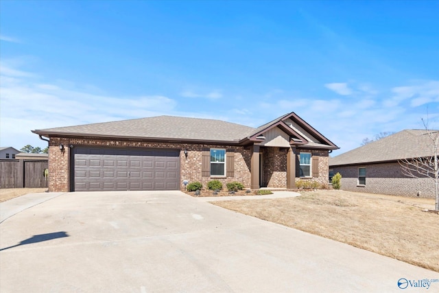 view of front of property featuring brick siding, a shingled roof, fence, a garage, and driveway