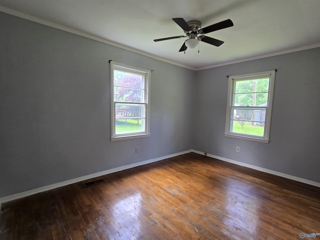 unfurnished room featuring ornamental molding, hardwood / wood-style floors, baseboards, and a ceiling fan