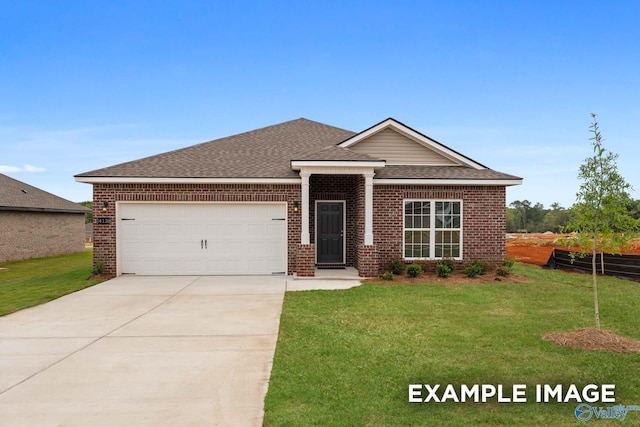 view of front of property with a garage and a front yard