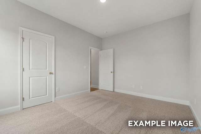 unfurnished bedroom featuring carpet floors