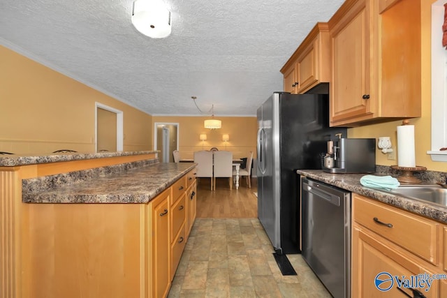 kitchen with stainless steel dishwasher, ornamental molding, and a textured ceiling