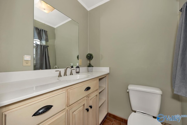 bathroom featuring tile patterned flooring, vanity, toilet, and ornamental molding